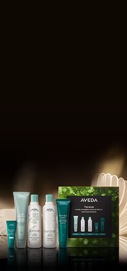 Icons set on a plinth with a green curtain behind
